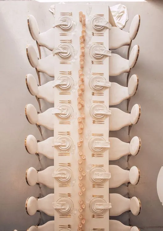 Ivory table service at long rectangular table