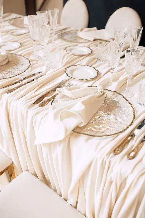 Ivory table setting at rectangular table
