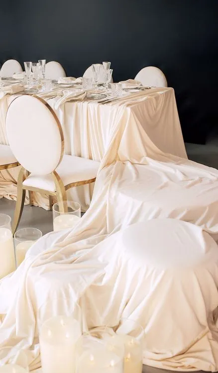 Ivory table setting at rectangular table