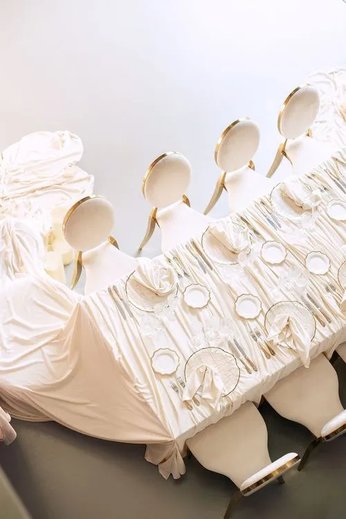 Ivory table setting at rectangular table