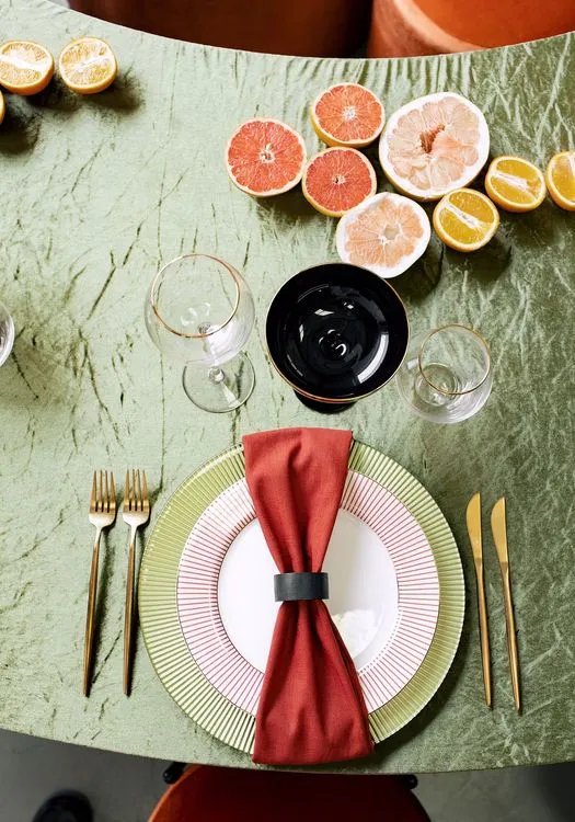 Orange green serpentine table set with poufs