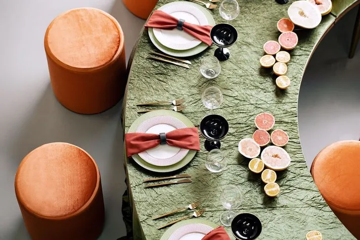 Orange green serpentine table set with poufs
