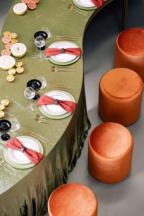 Orange green serpentine table set with poufs