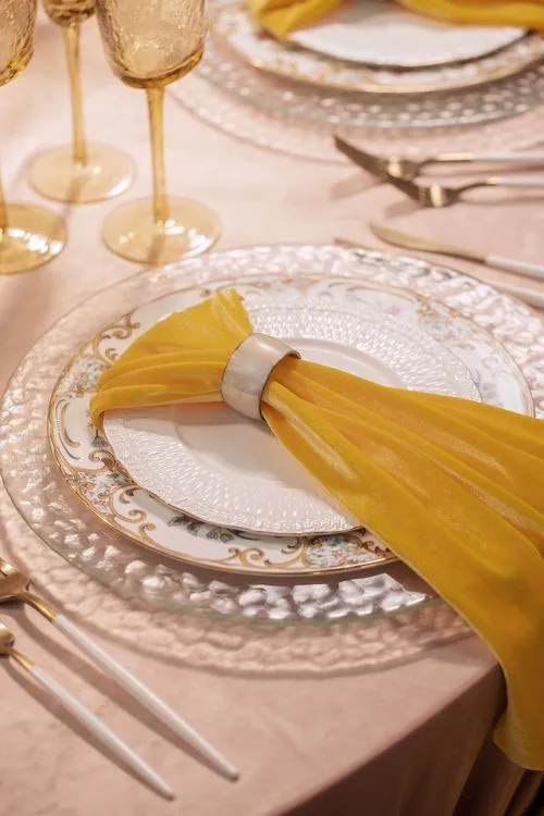 Peach-lavender table setting at caterpillar table