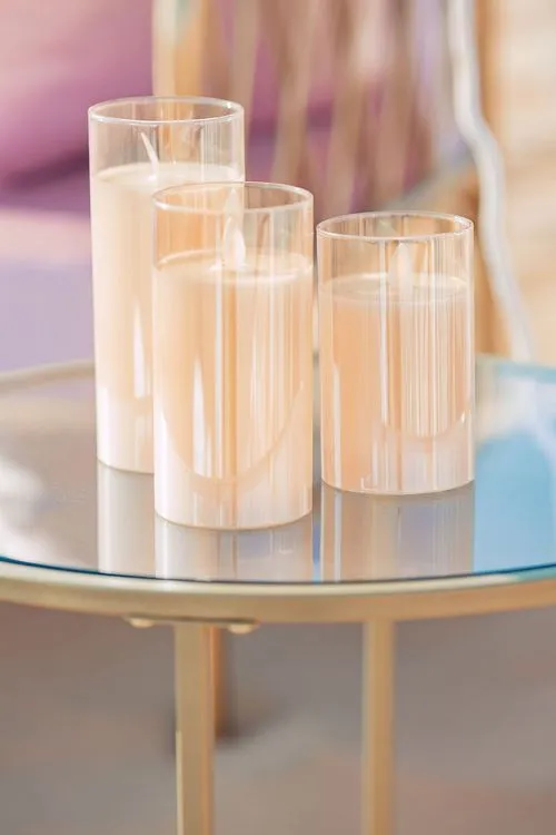 Pink desert lounge setup with ottomans