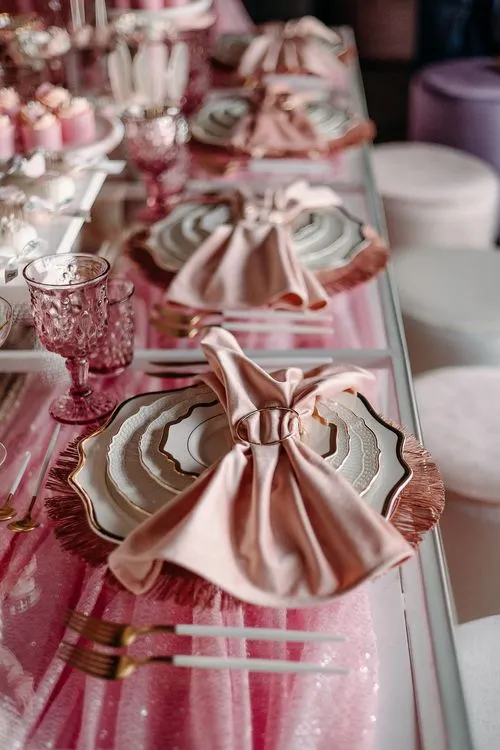 Pink kids party with velvet poufs