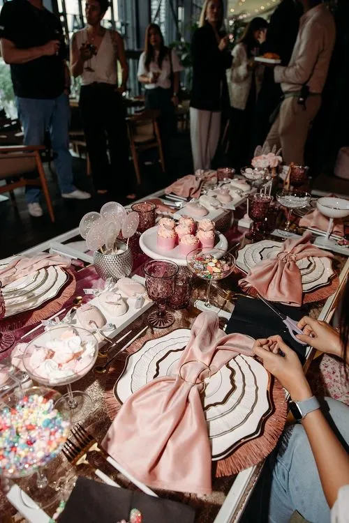 Pink kids party with velvet poufs