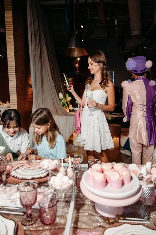 Pink kids party with velvet poufs