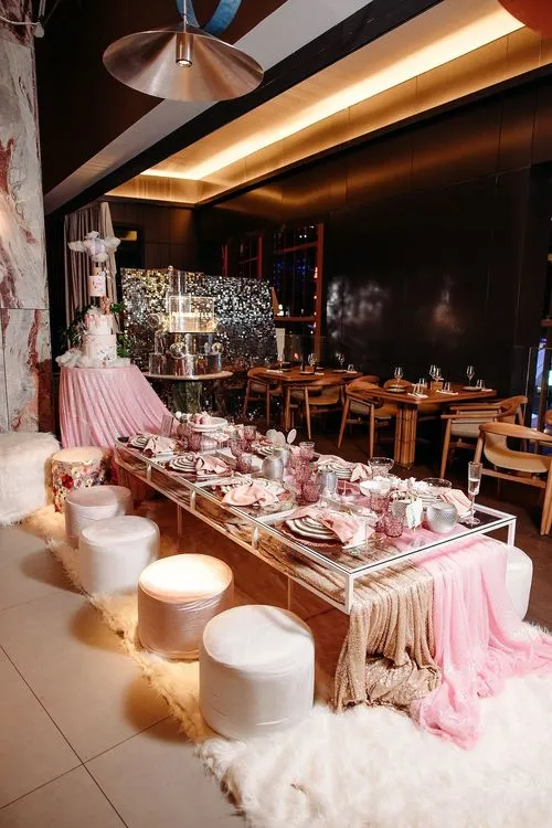 Pink kids party with velvet poufs