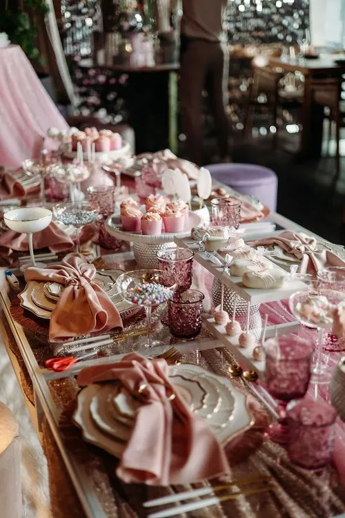Pink kids party with velvet poufs