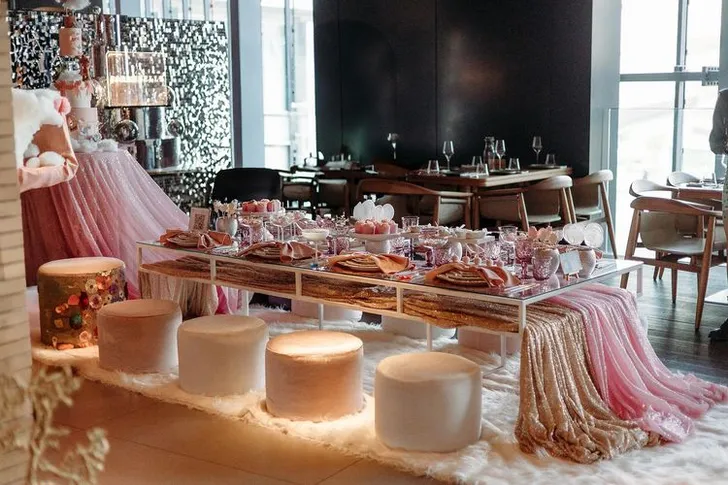 Pink kids party with velvet poufs