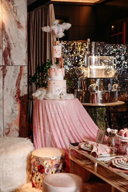 Pink kids party with velvet poufs