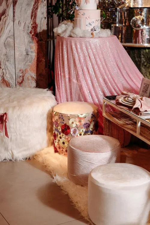 Pink kids party with velvet poufs