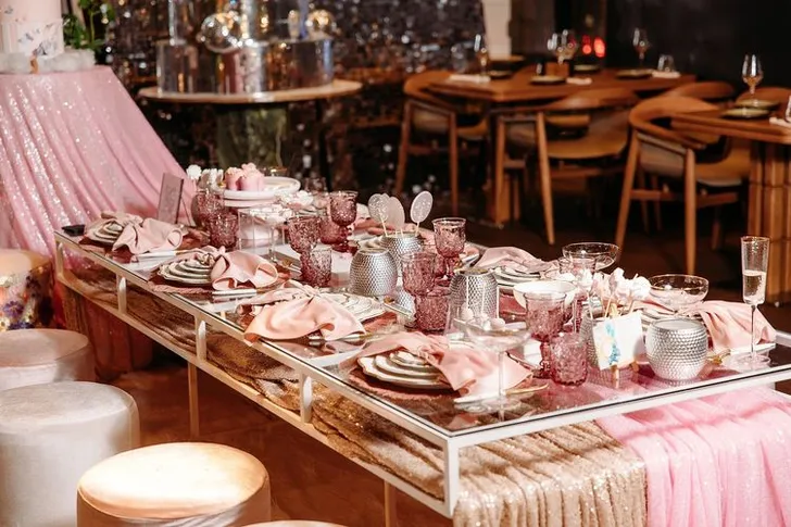 Pink kids party with velvet poufs