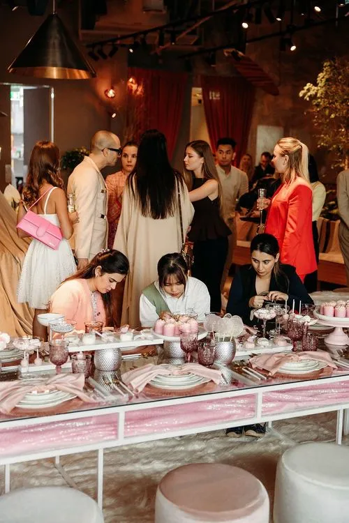 Pink kids party with velvet poufs