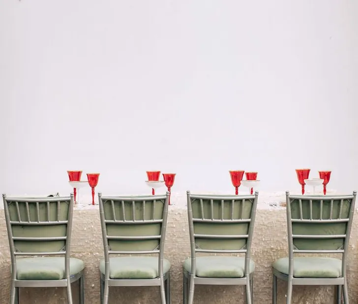 Pistachio-red table setting at rectangular table