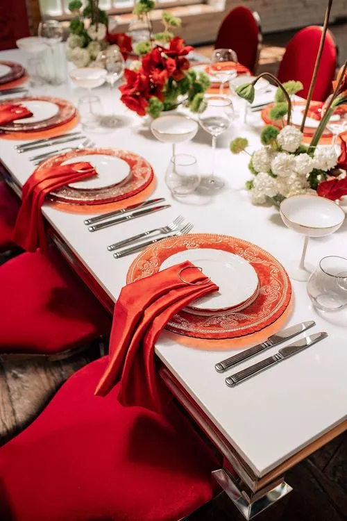 Red table setting at rectangular table