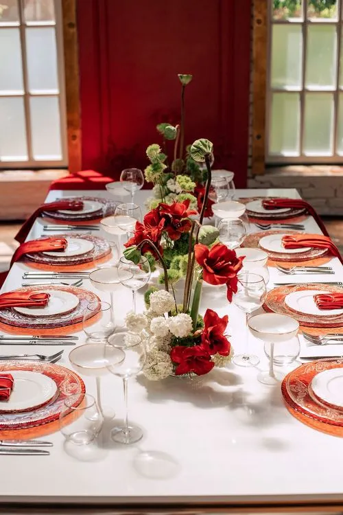 Red table setting at rectangular table