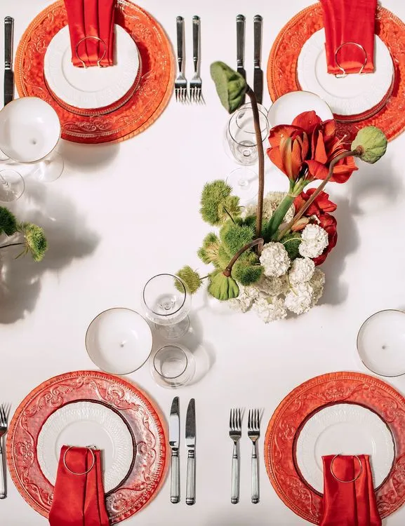 Red table setting at rectangular table