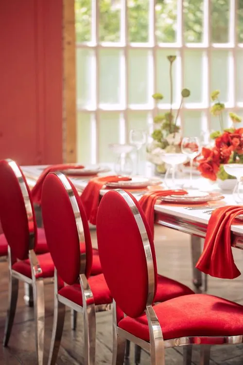 Red table setting at rectangular table