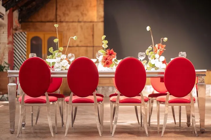 Red table setting at rectangular table