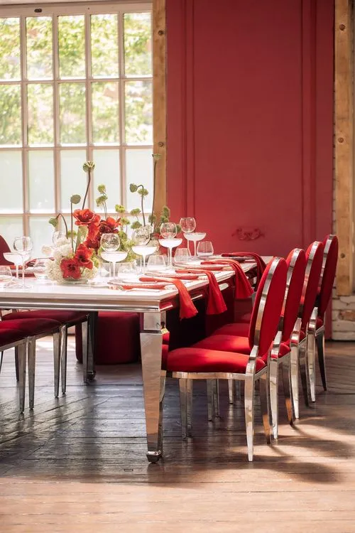 Red table setting at rectangular table