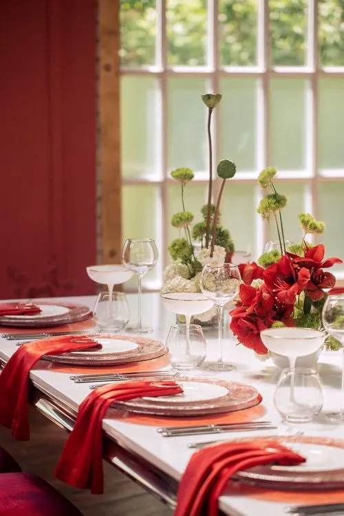 Red table setting at rectangular table