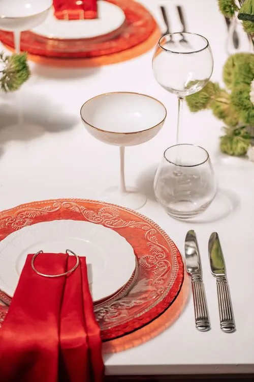 Red table setting at rectangular table
