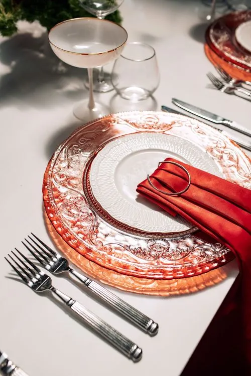 Red table setting at rectangular table