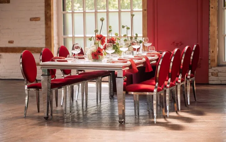 Red table setting at rectangular table