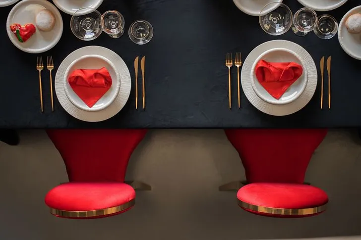 Red-black table setting at rectangular table