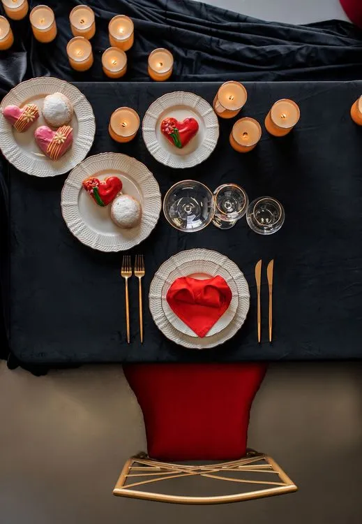 Red-black table setting at rectangular table