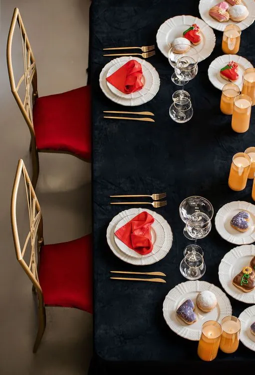 Red-black table setting at rectangular table