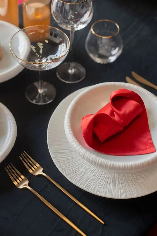 Red-black table setting at rectangular table