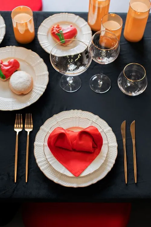 Red-black table setting at rectangular table