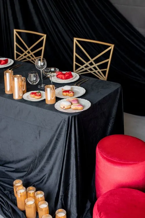 Red-black table setting at rectangular table