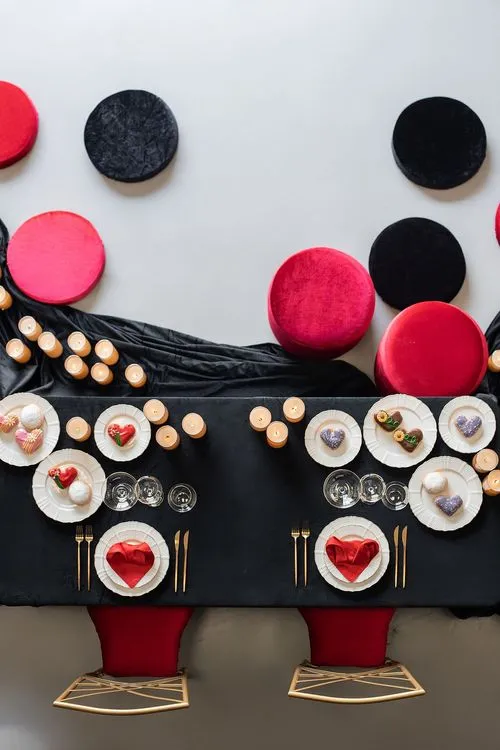 Red-black table setting at rectangular table