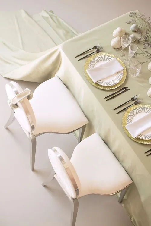 Soft green table setting at rectangular table