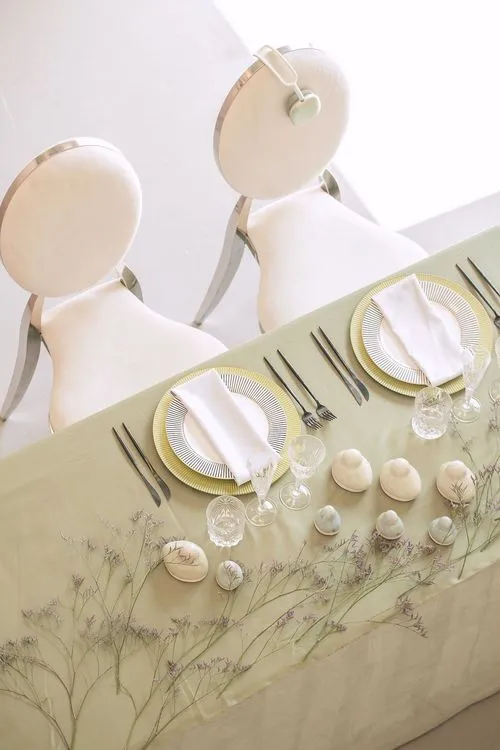 Soft green table setting at rectangular table