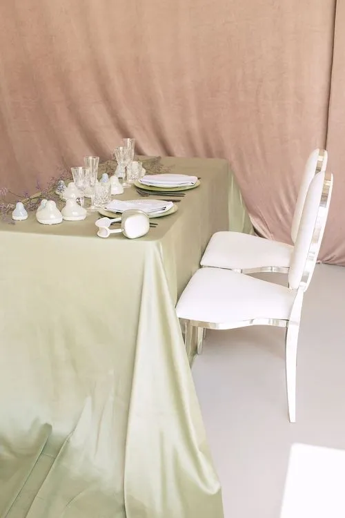 Soft green table setting at rectangular table