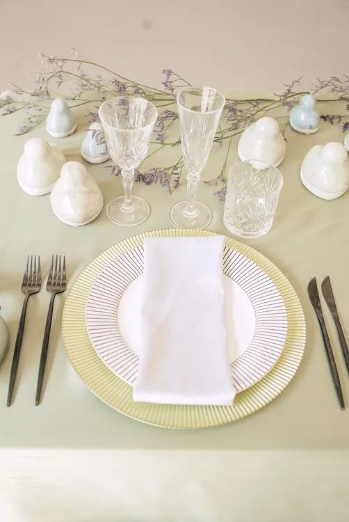 Soft green table setting at rectangular table