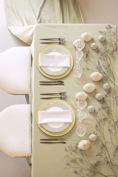 Soft green table setting at rectangular table