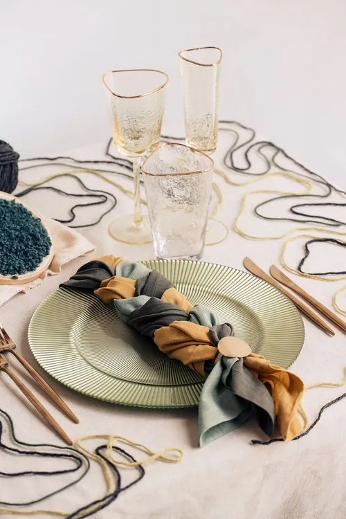 Soft green table setting with embroidery hoops