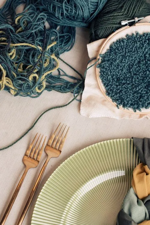 Soft green table setting with embroidery hoops