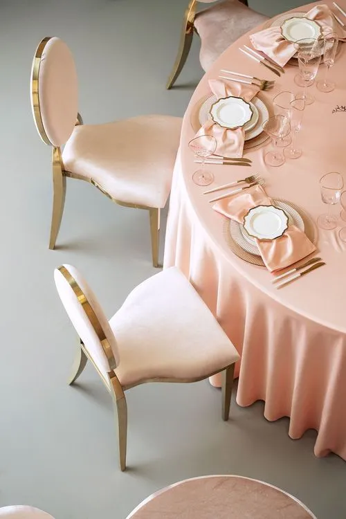 Soft pink table setting at round table