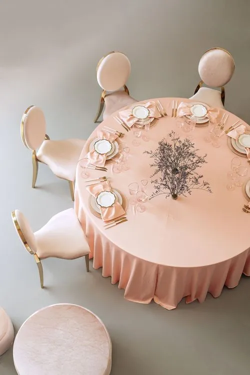 Soft pink table setting at round table