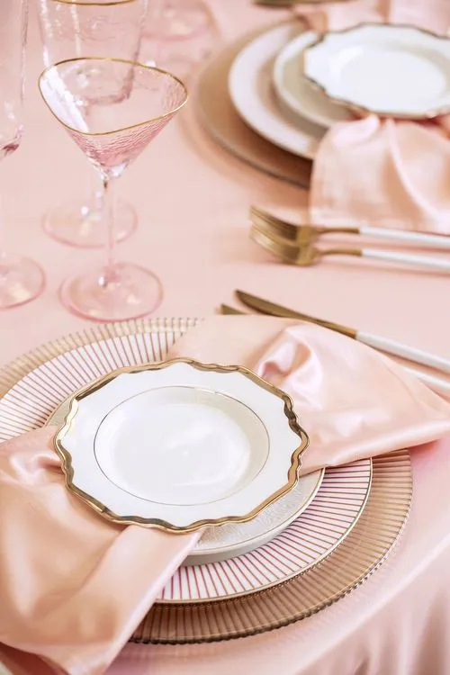 Soft pink table setting at round table