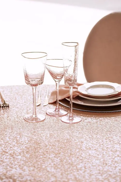 Soft pink table setting at round table