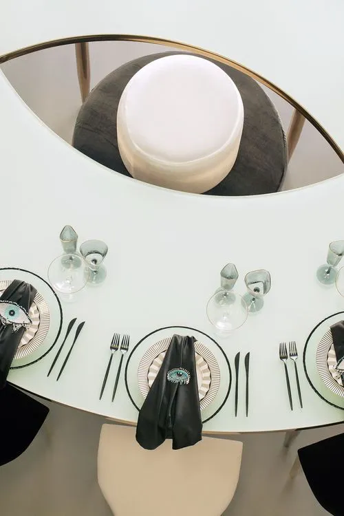 Eye-shaped table and black-and-white set