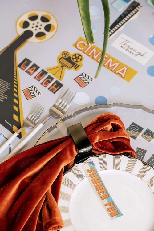 Table setting with orange accents at rectangular table